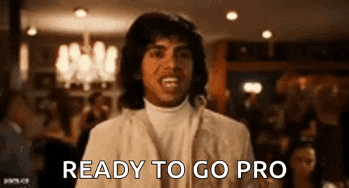 a man in a white suit is ready to go pro in a restaurant .