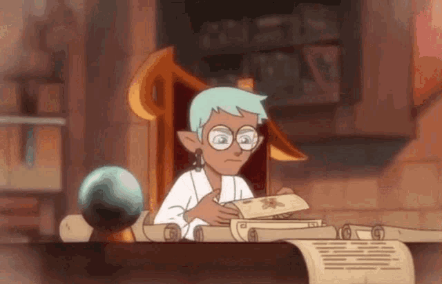 a cartoon character is sitting at a table holding a book and a scroll .