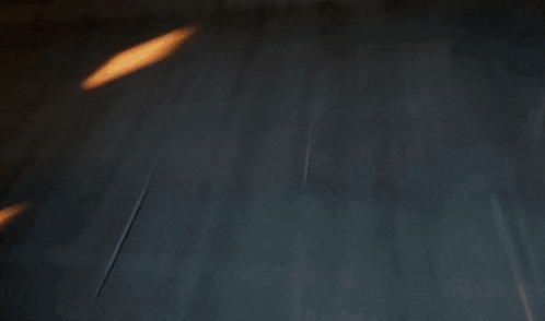 a flame is coming out of the ground in a dark room