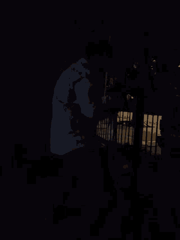 a dark room with a few lights visible