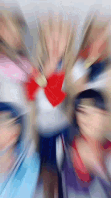 a blurry image of a person with a red bow tie