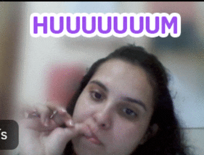 a woman with a purple sticker that says huhuuum