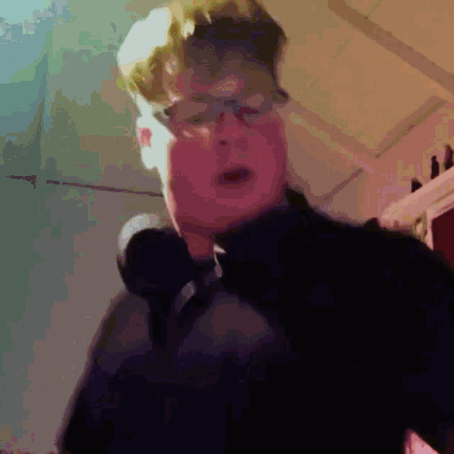 a man with glasses is singing into a microphone in a painting
