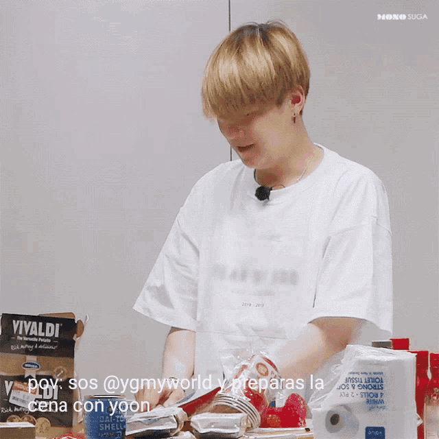 a person standing in front of a table with a box of vivaldi cookies in the background