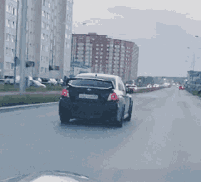 a car is driving down a street with a license plate that says ts - ts - ts