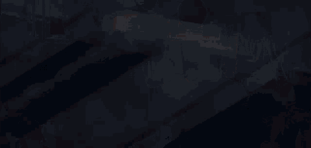 a person holding another person 's arm with a belt that says malhalla