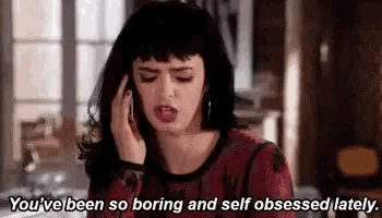 a woman is talking on a cell phone and saying `` you 've been so boring and self-obsessed lately . ''