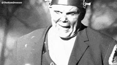 a black and white photo of a man with the name thekamdreesen at the top