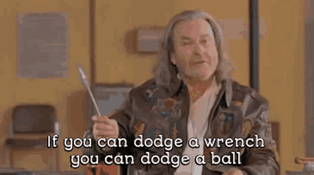 a man is standing in front of a building with a wrench in his hand and a quote .