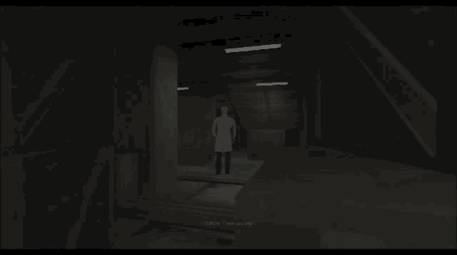 a man in a lab coat stands in a dark room and says gmch there you are !