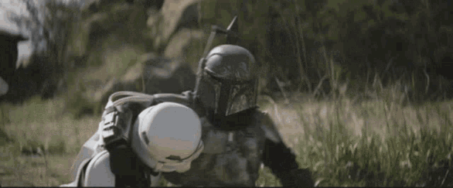 a close up of a person wearing a helmet and armor .