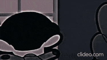 a close up of a cartoon character 's head with a shadow of a person behind it .
