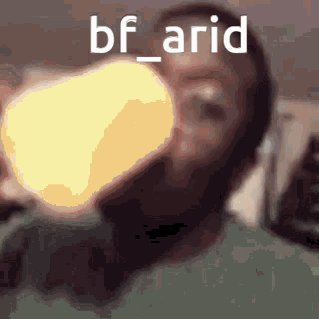 a man is drinking from a bottle with the words bf_arid on the bottom