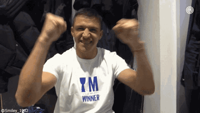 a man wearing a shirt that says tm winner on it