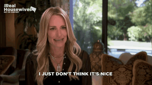 a woman says i just don 't think it 's nice while sitting in front of a window