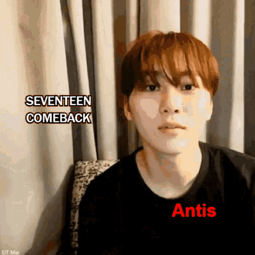 a young man wearing a black shirt that says antis