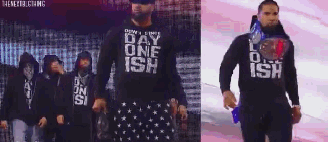 a man wearing a shirt that says day one ish is walking on a stage