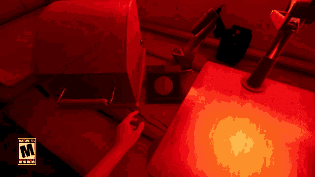 a person is playing a video game with a warning label on the bottom right corner