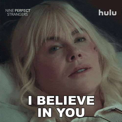 a woman laying in bed with the words " i believe in you " on the bottom
