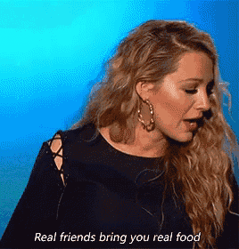 a woman in a black dress says real friends bring you real food