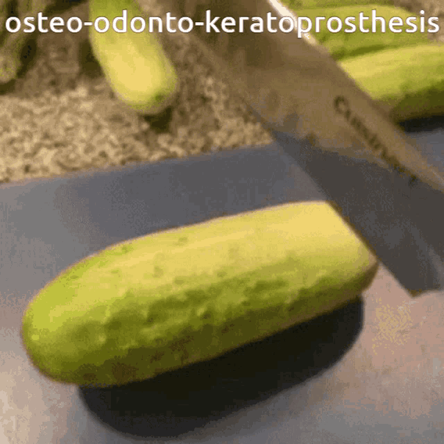 a knife is cutting a cucumber on a cutting board with the words osteo-odonto-keratoprosthesis below it