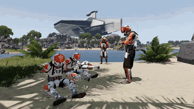 a group of soldiers laying on the ground on a beach