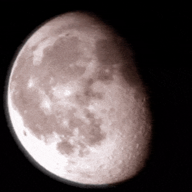 a close up of a full moon with a dark background