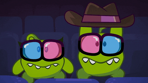 two green cartoon characters wearing 3d glasses in a theater