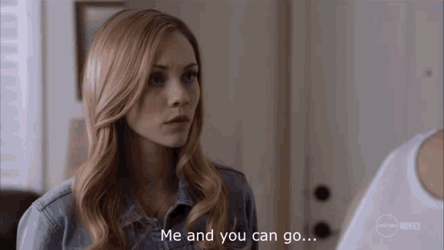 a woman in a denim shirt is talking to another woman and says me and you can go