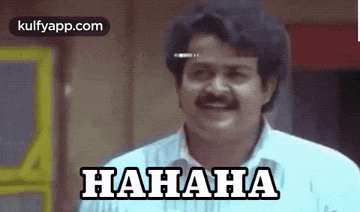 a man with a mustache is laughing with the words `` hahaha '' on his face .