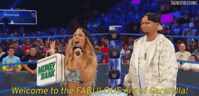 a woman is standing in a wrestling ring with a microphone and a sign that says money bank