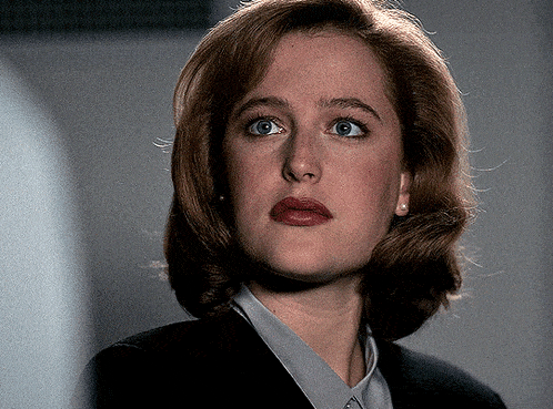 a close up of a woman wearing a black jacket
