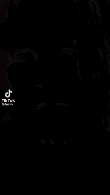 a blurred image of a man in a military uniform with a tiktok watermark