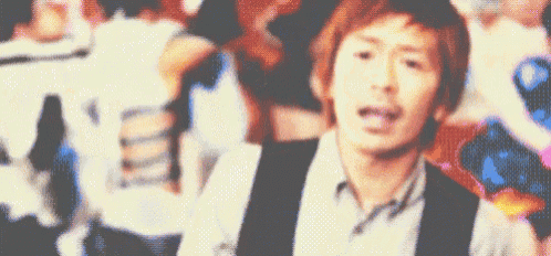 a blurry picture of a man in a crowd of people