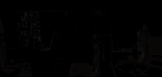 a pixelated image of a person holding a blue item