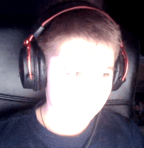 a person wearing headphones with a glowing face