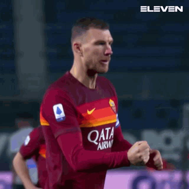 a soccer player wearing a jersey that says qata on it
