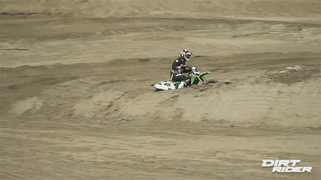 a dirt bike rider with the number 45 on the back