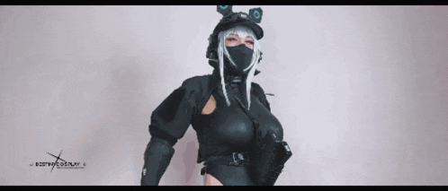 a woman in a costume with the word cosplay on the bottom left