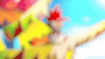 a blurred image of a clown with a red star on his hat
