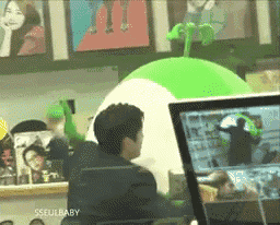 a man sitting in front of a computer with the word sseulbaby on the bottom