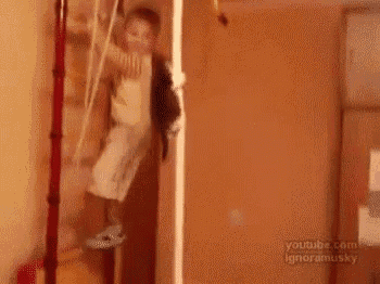 a person is walking through a doorway in a room with a dresser .