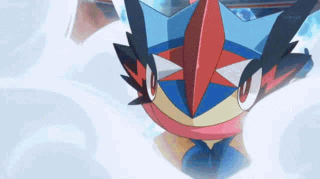 a close up of a cartoon character with a red , blue , and yellow face flying through the air .