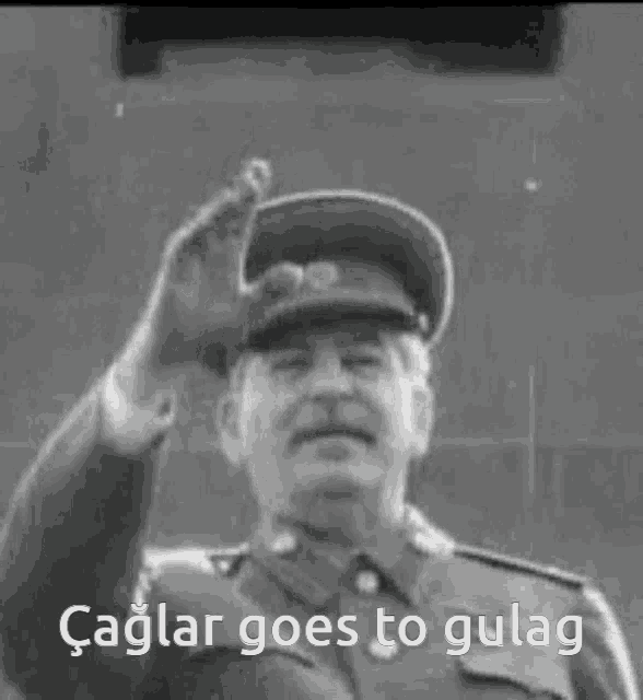 a black and white photo of a man with the caption " caglar goes to gulag " on the bottom
