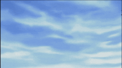 a person wearing a mask with a blue sky behind them