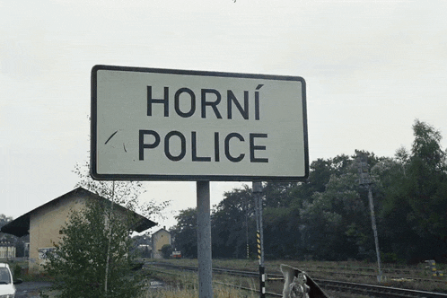a sign that says horni police in black letters