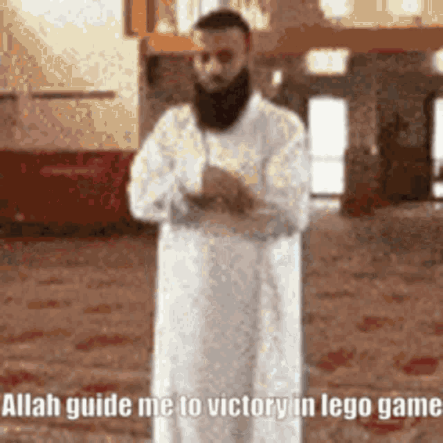 a man with a beard is praying in a mosque with the words allah guide me to victory in lego game .