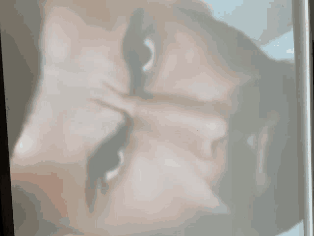 a close up of a person 's face with their eyes closed