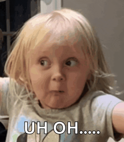 a little girl with blonde hair is making a funny face and says uh oh