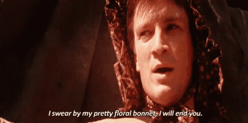 a man wearing a floral bonnet says i swear by my pretty floral bonnet